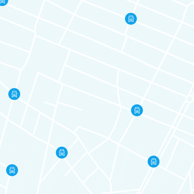 Simplified city map with a light grid of streets, displaying several blue location markers with a vehicle icon and one yellow marker with an upward‐arrow icon